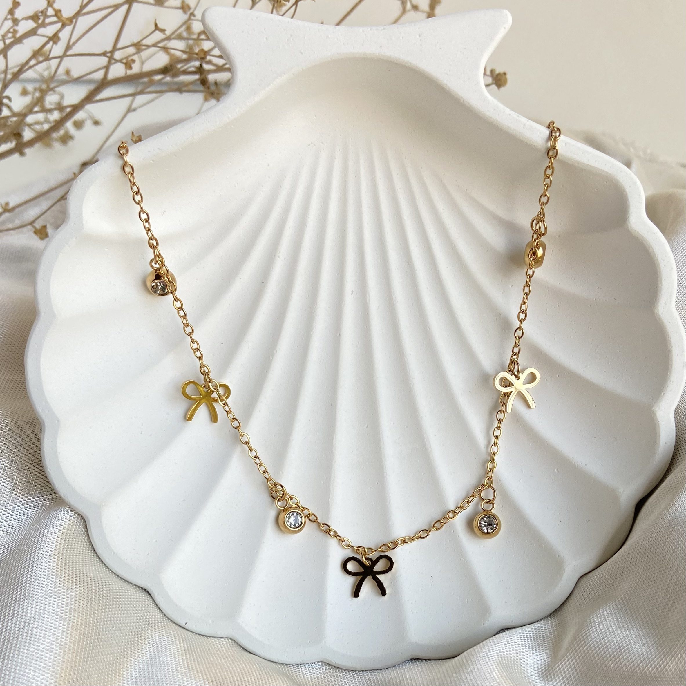 Anti-tarnish trendy bow charm necklace – minimal waterproof jewellery for women.